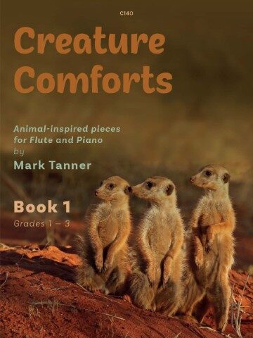 his is the cover of "Creature Comforts: Animal-inspired pieces for Flute and Piano by Mark Tanner," Book 1, for grades 1-3. The image features three meerkats standing on red earth, with the title and author information prominently displayed above them. This book is part of a series of two books for flute and piano and is inspired by animals. The series is published in two volumes: grades 1-3 and grades 4–6