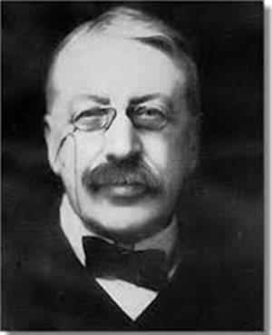 Black and white image of composer Charles Villiers Stanford