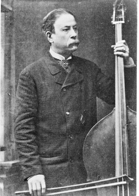 Photograph in black and white of Giovanni Bottesini holding a double bass and bow.