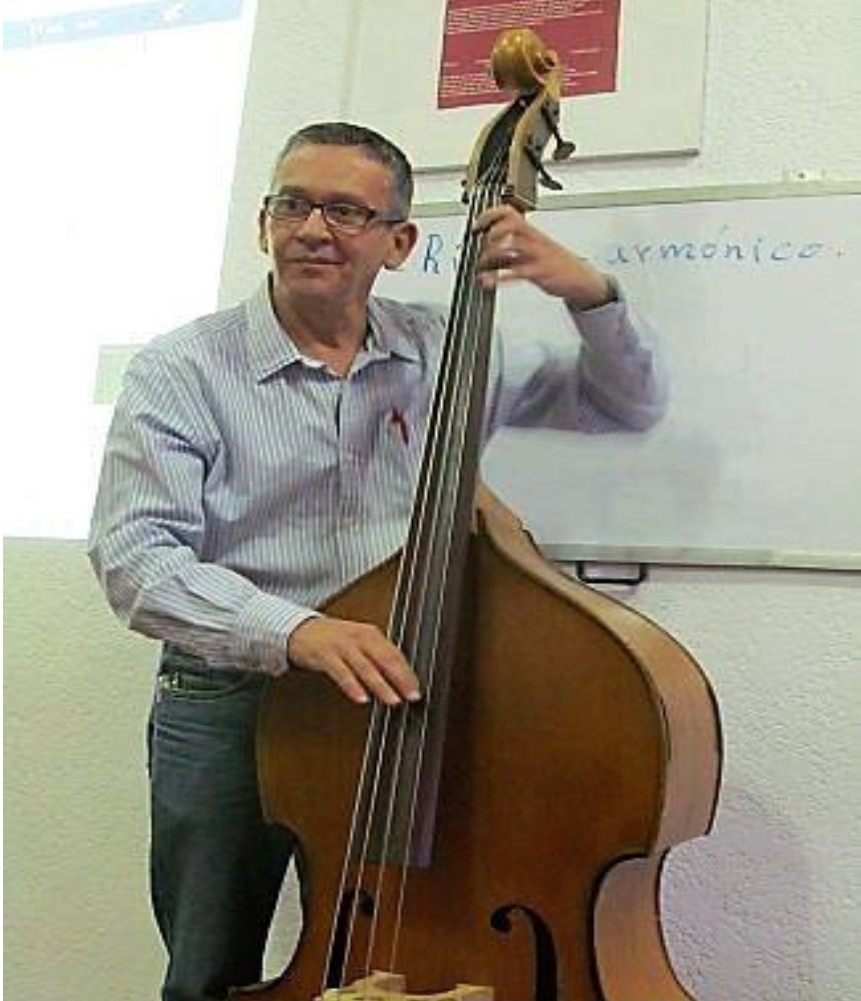 Photograph of Mexican composer Luis Guillermo Perez playing his double bass