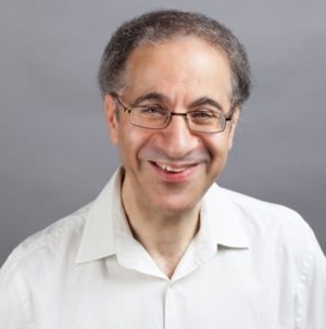 Photograph of composer Paul Harris wearing a white shirt.