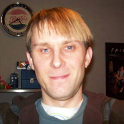 Photgraph of blond haired, Welsh composer Jayson Mackie